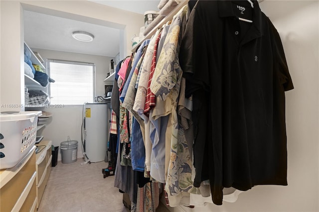 walk in closet featuring water heater