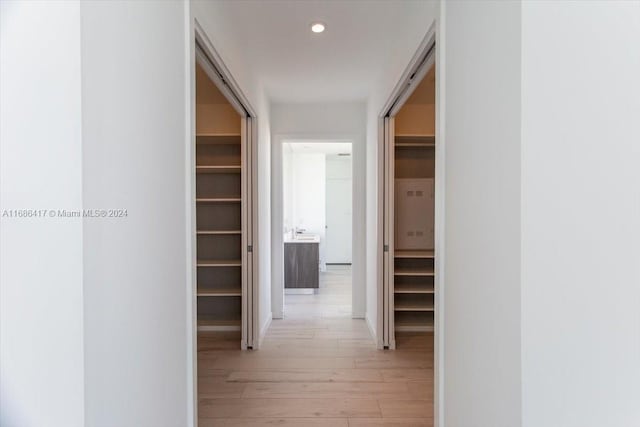 hall with light hardwood / wood-style flooring