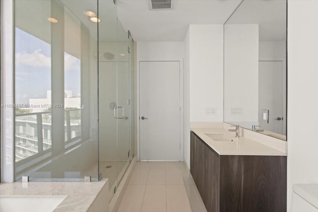 bathroom featuring vanity, tile patterned floors, and an enclosed shower