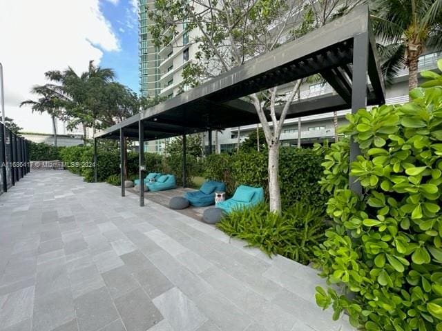 view of vehicle parking featuring a carport