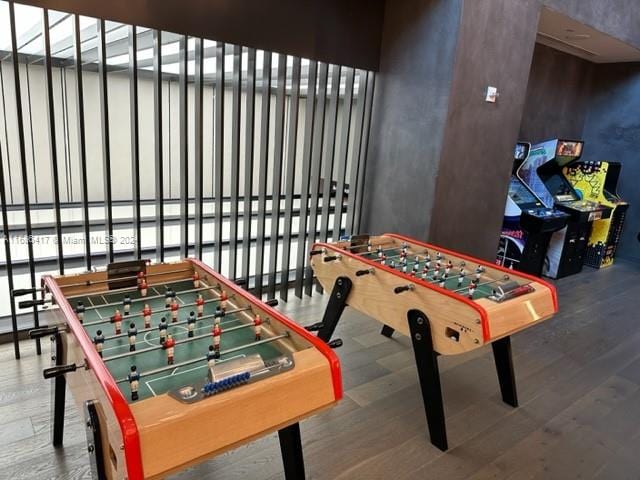 recreation room with hardwood / wood-style floors