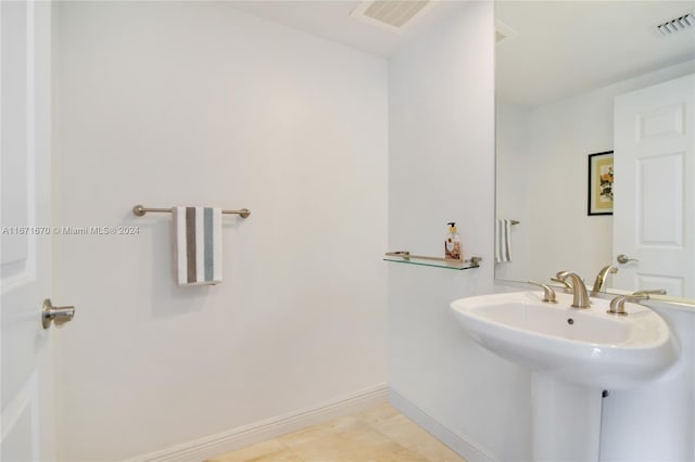 bathroom with tile patterned floors and sink