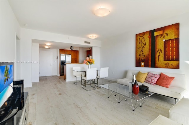 living room with light hardwood / wood-style floors