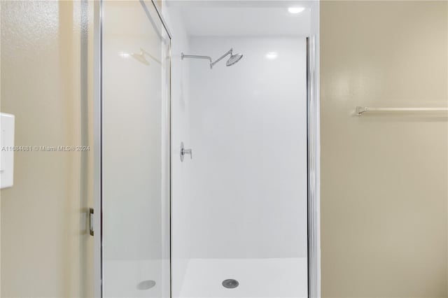 bathroom featuring an enclosed shower