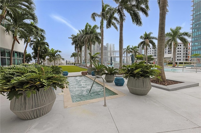 view of swimming pool featuring a patio area