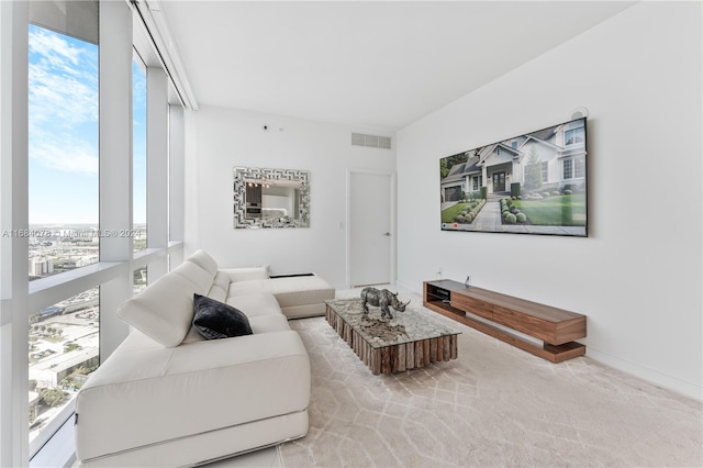 living room featuring a wealth of natural light and light carpet