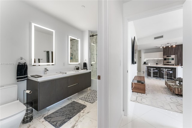 851 NE 1st Ave Unit 3302, Miami, FL 33132 - full bath featuring toilet, double vanity, and backsplash