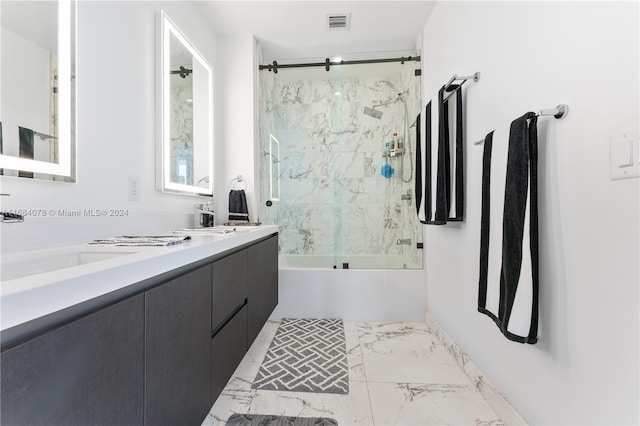 bathroom featuring vanity and enclosed tub / shower combo