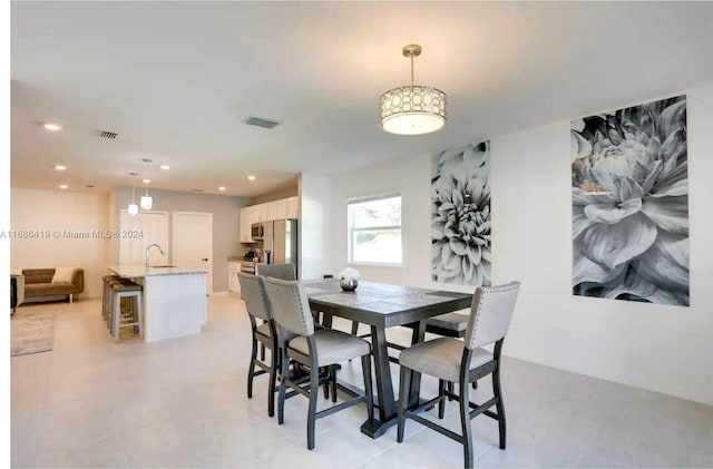 dining space with sink