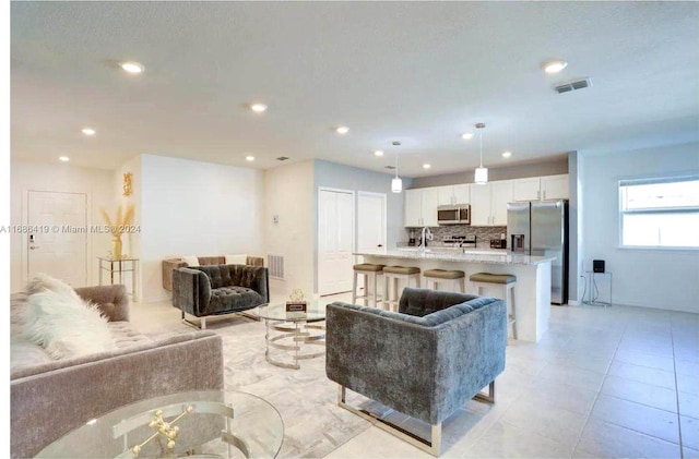 2613 SW Harem Cir, Port St Lucie, FL 34953 - living area with recessed lighting and light tile patterned flooring