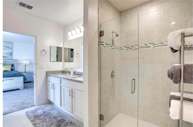 2613 SW Harem Cir, Port St Lucie, FL 34953 - bathroom with ensuite bath, vanity, a shower stall, and tile patterned flooring