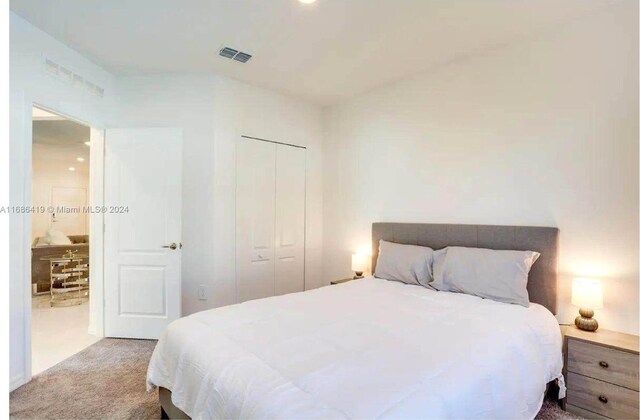 2613 SW Harem Cir, Port St Lucie, FL 34953 - bedroom with carpet and a closet