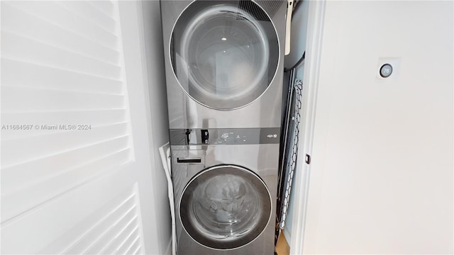 laundry area featuring stacked washing maching and dryer