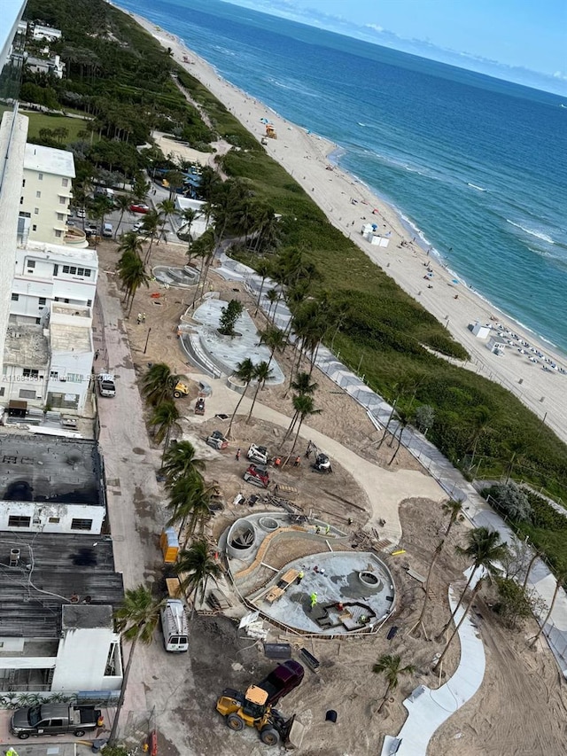 bird's eye view with a view of the beach and a water view