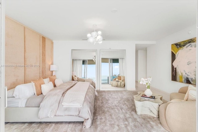 bedroom with carpet floors and an inviting chandelier