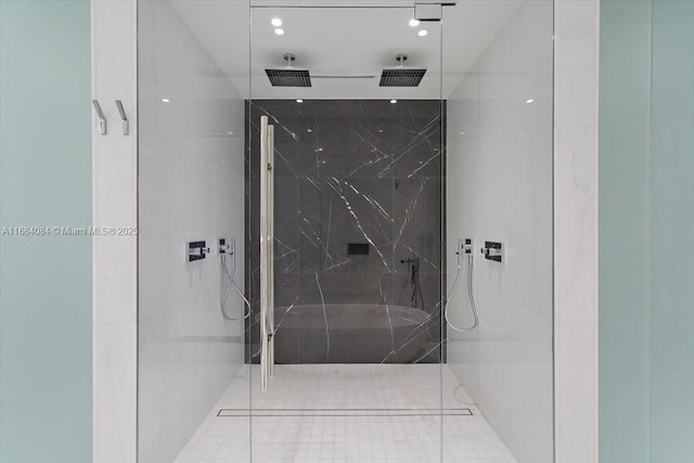 full bath with a marble finish shower and recessed lighting