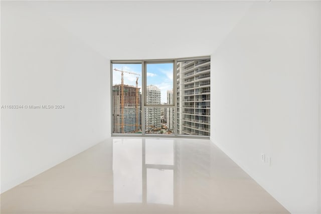 empty room featuring expansive windows