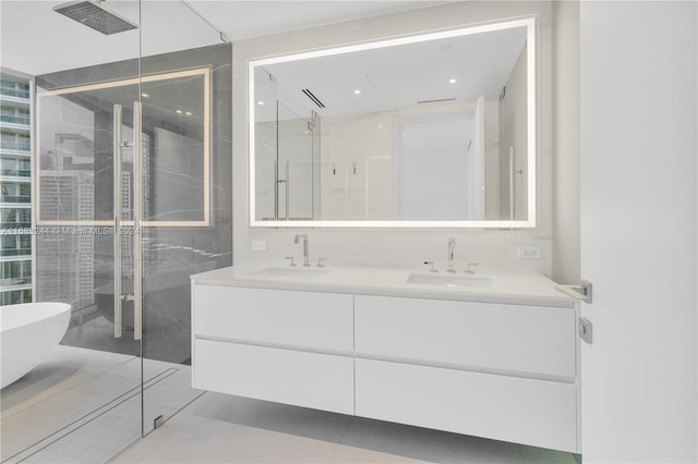 bathroom featuring vanity, independent shower and bath, and tile patterned flooring