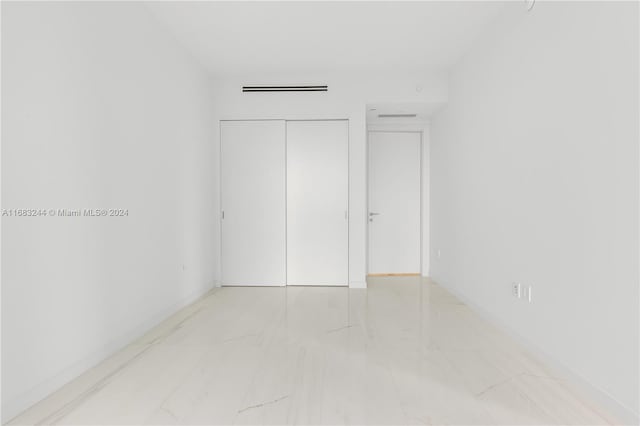 unfurnished bedroom featuring a closet