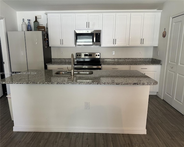 kitchen featuring white cabinets, appliances with stainless steel finishes, and sink