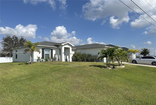 ranch-style home with a front yard and a garage