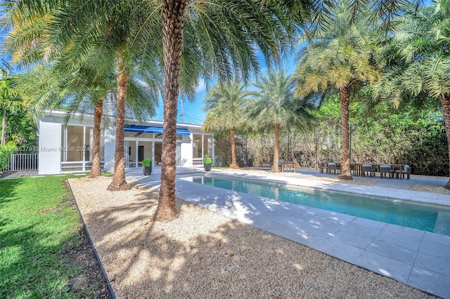 view of pool with a patio area and french doors