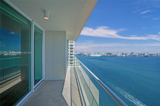 balcony featuring a water view