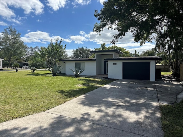 2128 Sycamore Dr, Winter Park, FL 32789 - mid-century inspired home featuring a garage, stucco siding, and concrete driveway