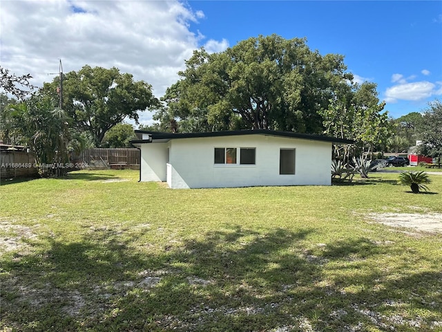 view of home's exterior featuring a yard