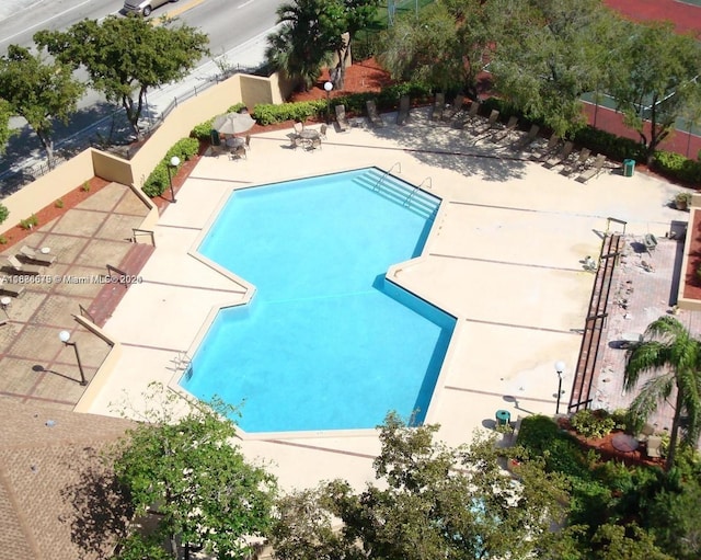 view of swimming pool with a patio area