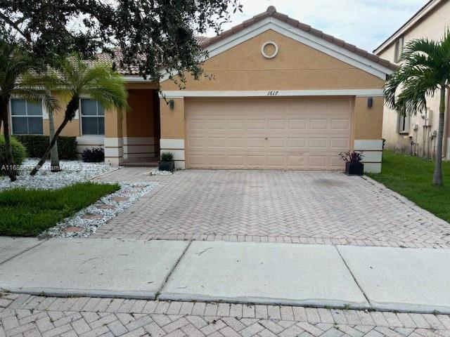 single story home featuring a garage