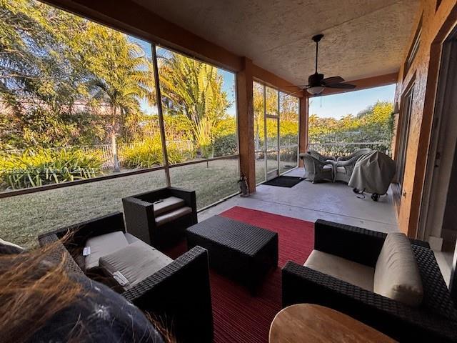 view of patio with ceiling fan and an outdoor hangout area