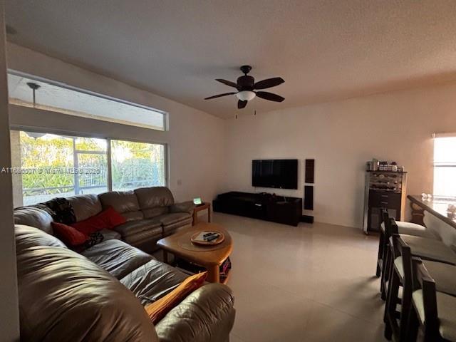 living room with ceiling fan