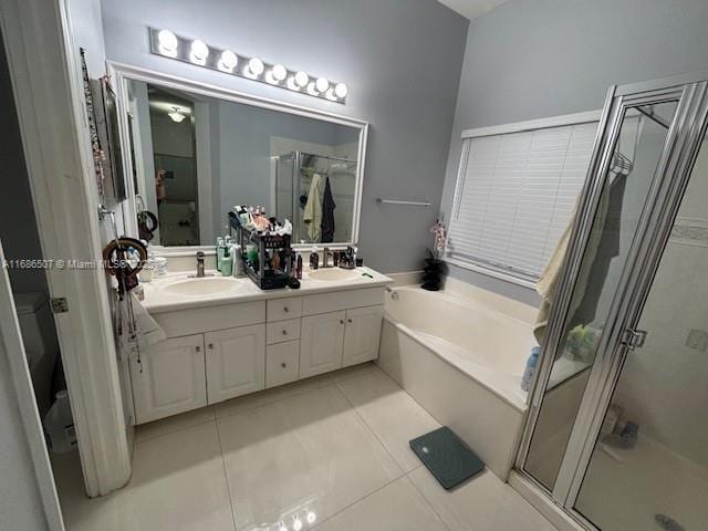 bathroom with separate shower and tub, tile patterned flooring, and vanity