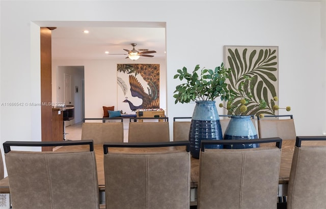 dining room featuring ceiling fan