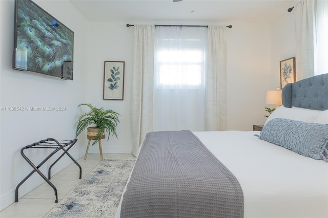 bedroom with light tile patterned floors