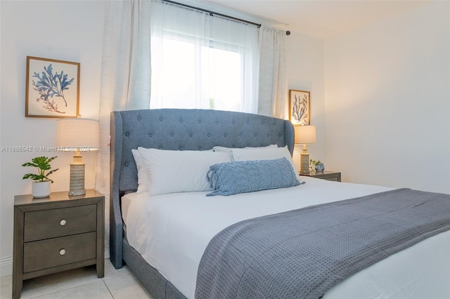 bedroom with light tile patterned flooring