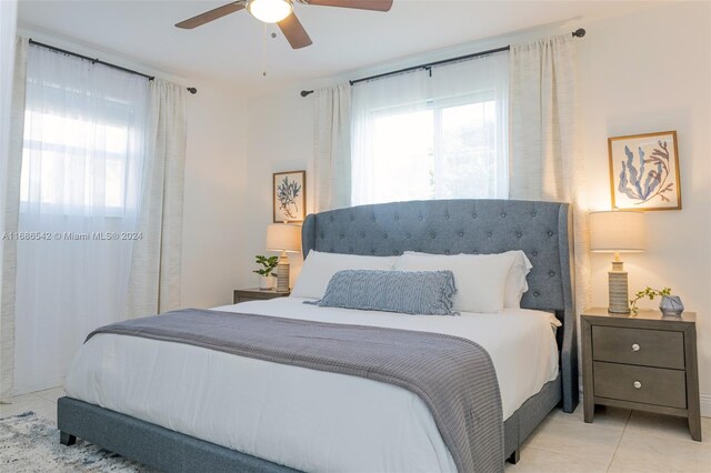 tiled bedroom with ceiling fan