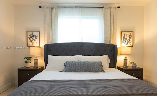 bedroom with tile patterned floors