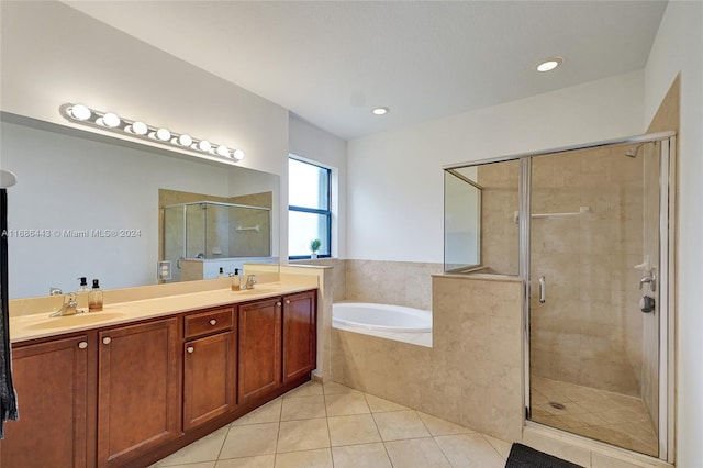 bathroom featuring vanity, independent shower and bath, and tile patterned flooring