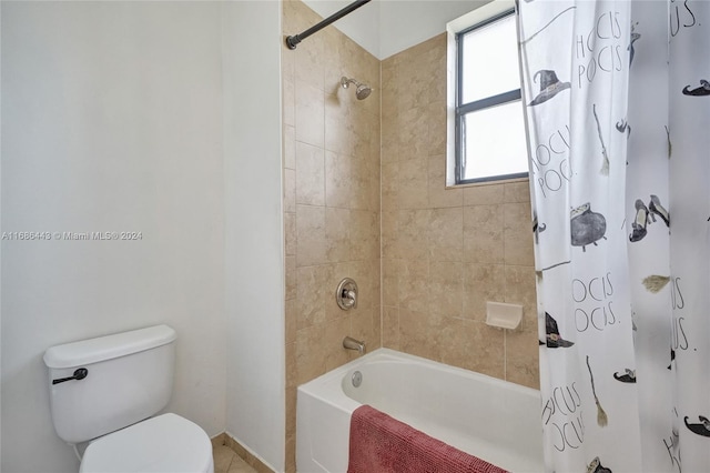 bathroom with shower / bath combo with shower curtain and toilet