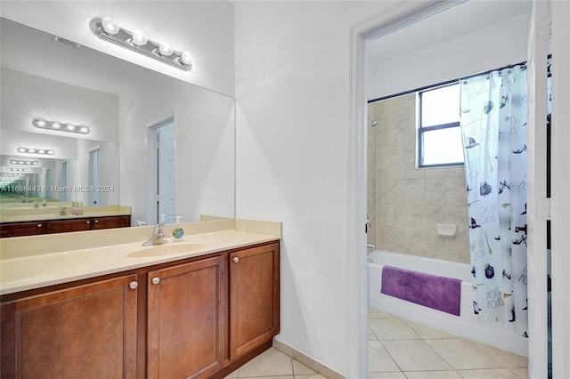 bathroom featuring vanity, shower / bath combo, and tile patterned flooring