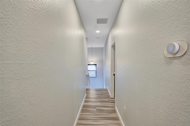 hallway featuring light hardwood / wood-style flooring