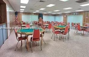 dining area with a paneled ceiling