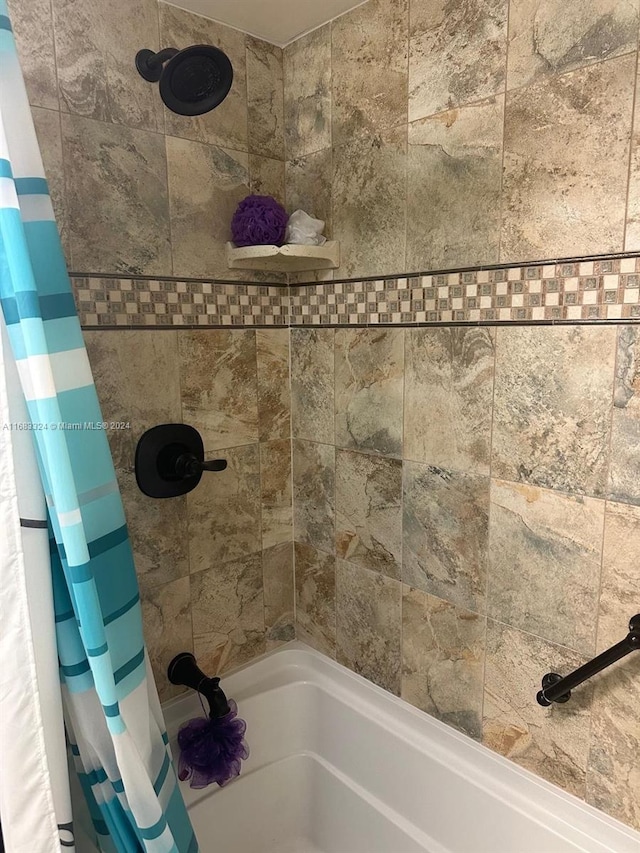 bathroom featuring shower / bath combo with shower curtain