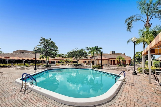 view of swimming pool with a patio area