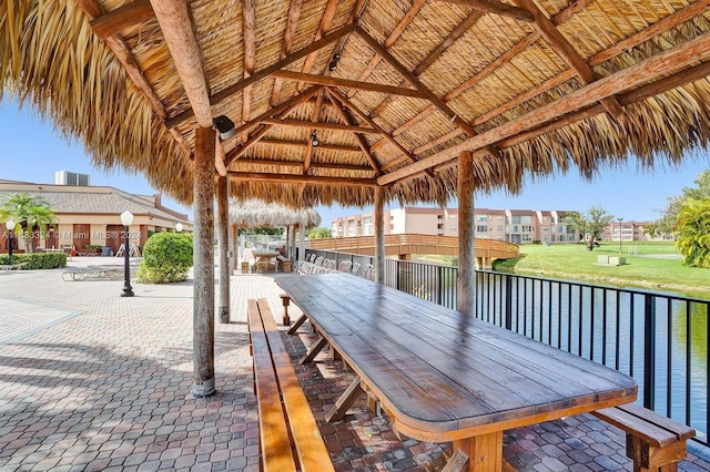 exterior space with a gazebo and a water view