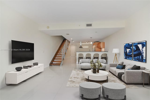 living room featuring light tile patterned flooring