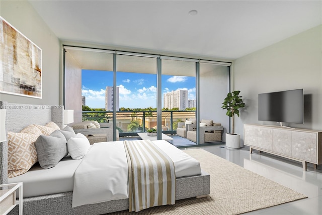 bedroom featuring access to exterior and floor to ceiling windows