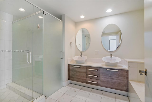 bathroom featuring vanity, walk in shower, and tile patterned flooring